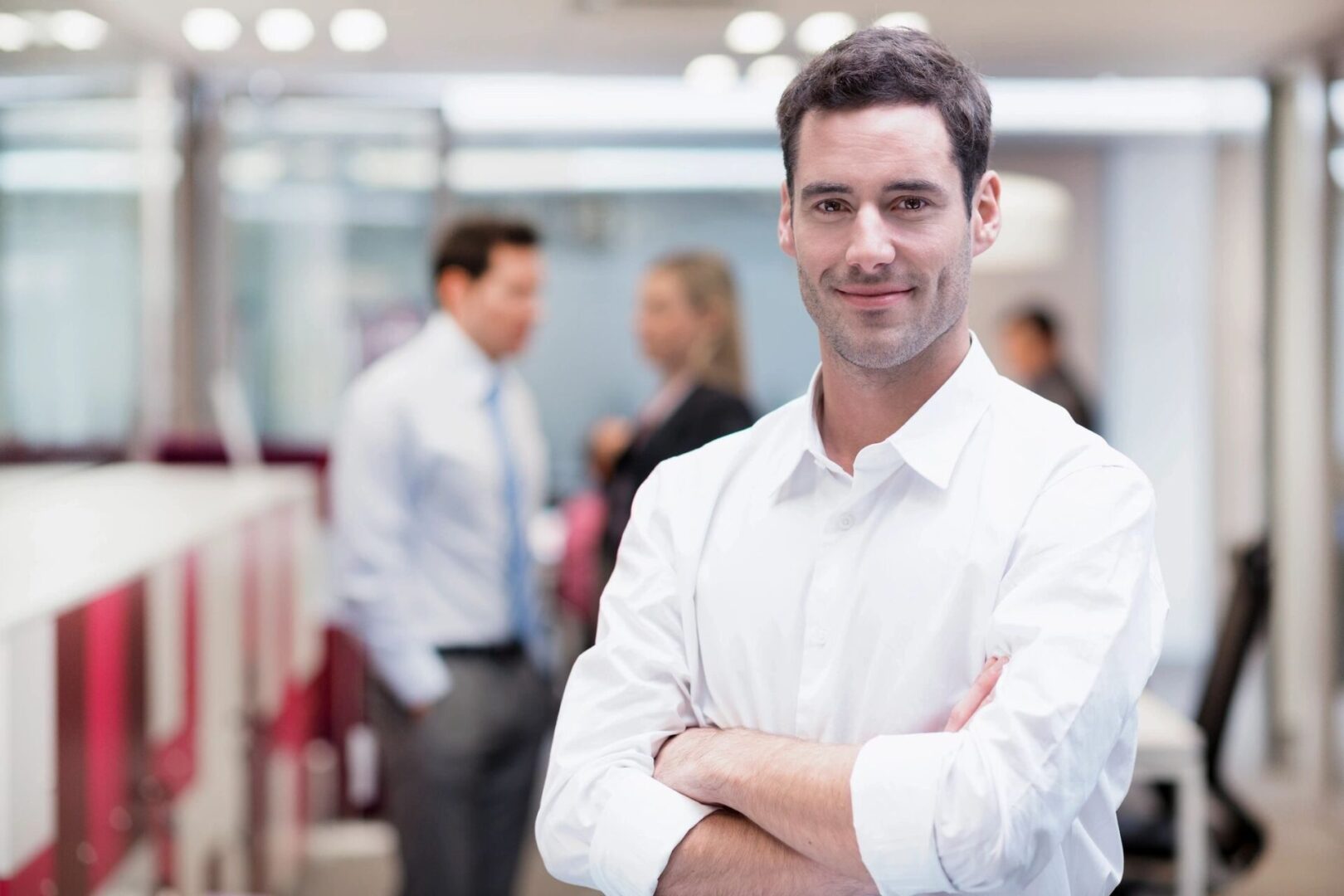 A man standing in front of other people.